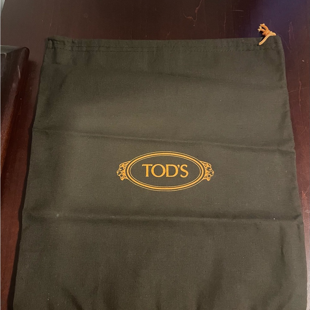 ** SOLD ** NWOT Tod’s Brown Dust Bag with Gold Logo